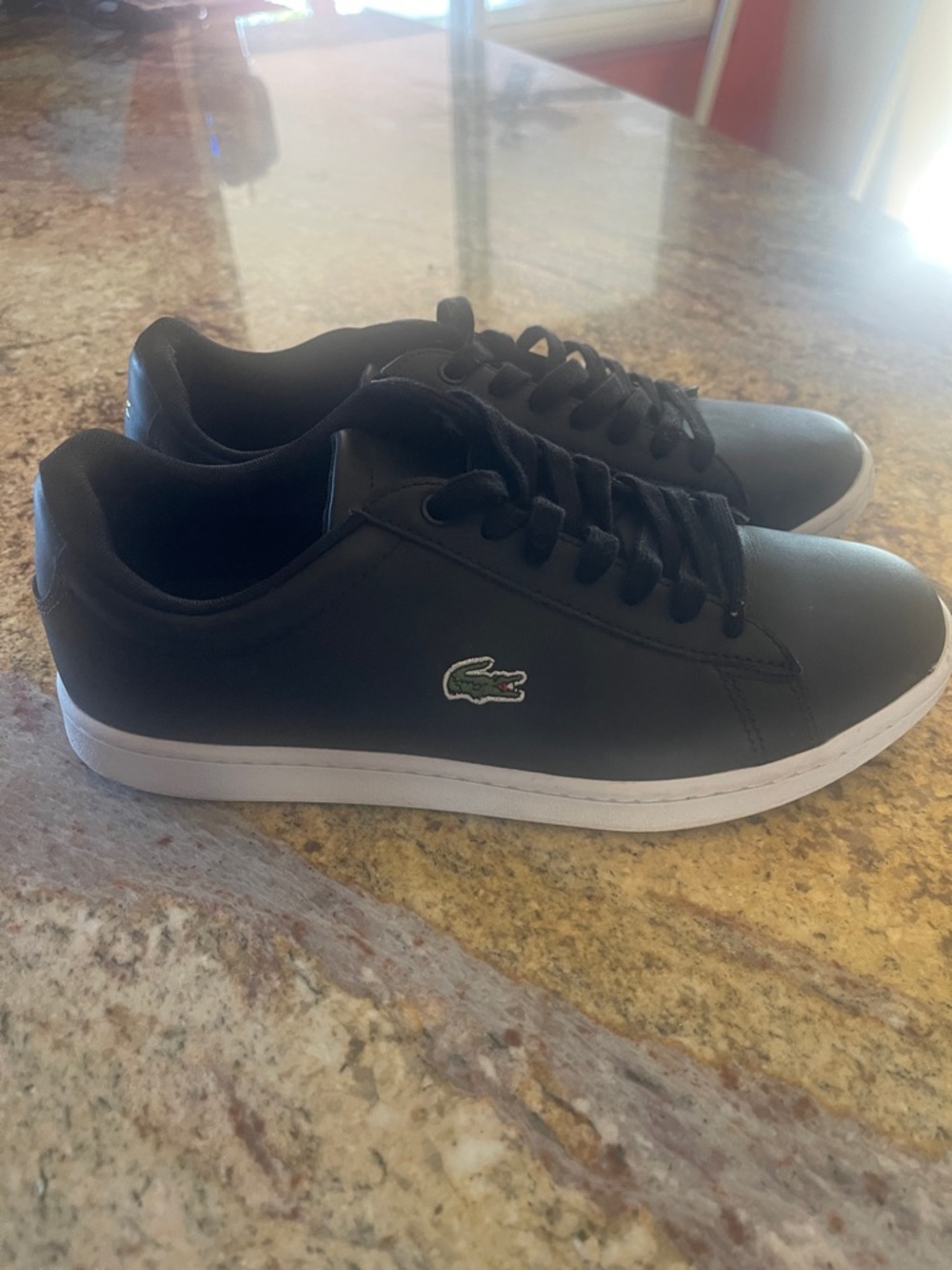 Lacoste Black Low-Top Sneakers with White Soles and Green Logo